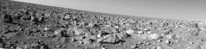 The rocky Martian plain surrounding NASA's Viking 2 is seen in high resolution in this 85-degree panorama sweeping from north at the left to east at right during the Martian afternoon on Sept. 5, 1976.