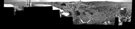 This image was taken by NASA's Viking Lander 1 at Chryse Planitia on Mars. The lander can be seen in the foreground looking toward the rugged martian terrain.