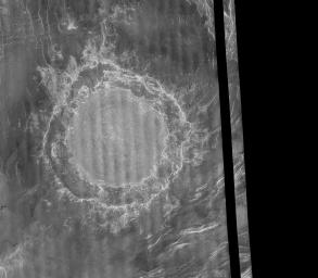 NASA's Magellan image mosaic shows the largest impact crater known to exist on Venus at this point in the Magellan mission. The crater is located north of Aphrodite Terra and east of Eistla Regio and was imaged during orbit 804 on November 12, 1990.