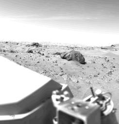 This Mars view looks northeast from NASA's Viking 1 and completes the 360 panorama of the landing site. A layer of haze can be seen in the Martian sky. Large dark boulders dominate the scene.