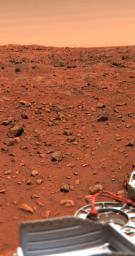 NASA's Viking 1 obtained this color picture of the Martian surface and sky on July 24, 1997; part of the spacecraft's gray structure in the foreground.