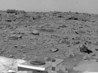 An area of very rocky terrain at the Ares Vallis landing site, along with the lander's deflated airbags, were imaged by NASA's Imager for Mars Pathfinder (IMP) on July 6, 1997.