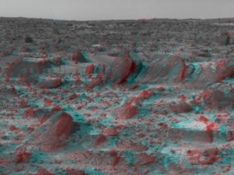 Many prominent rocks near the Sagan Memorial Station are featured in this image from NASA's Mars Pathfinder. 'Shark', 'Half-Dome', and 'Pumpkin' are at center 3D glasses are necessary to identify surface detail. 