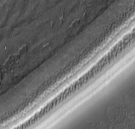 Textures of the south polar permanent residual ice cap and polar layered terrains. This 15 x 14 km area image (frame 7306) is centered near 87 degrees south, 341 degrees west, taken by NASA's Mars Global Surveyor Orbiter.