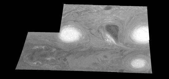 This mosaic shows the features of a hazy cloud layer tens of kilometers above Jupiter's main visible cloud deck as seen by NASA's Galileo orbiter on February 19, 1997.