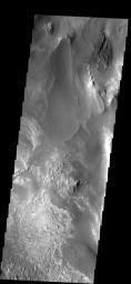 This image shows part of the floor of Melas Chasma. Layered materials and sand are common in this section of canyon on Mars, taken by NASA's Mars 2001 Odyssey spacecraft.