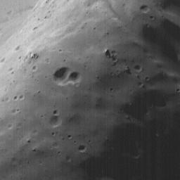 This image acquired on August 19, 1998 by NASA's Mars Global Surveyor shows Phobos, the inner and larger of the two moons of Mars. A close-up of the largest crater on Phobos, Stickney, shows ejecta blocks from the impact that formed Stickney.