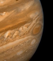 This color composite made from NASA's Voyager 2 shows the Great Red Spot during the late Jovian afternoon. North of the Red Spot lies a curious darker section of the South Equatorial Belt (SEB), the belt in which the Red Spot is located.