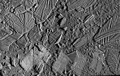 This mosaic of the Conamara Chaos region on Jupiter's moon, Europa, clearly indicates relatively recent resurfacing of Europa's surface. The background image in this picture was taken during NASA's Galileo spacecraft's sixth orbit of Jupiter.
