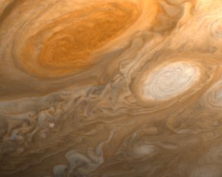 This photo of Jupiter was taken by NASA's Voyager 1 on the evening of March 1, 1979, from a distance of 2.7 million miles (4.3 million kilometers). The photo shows Jupiter's Great Red Spot (top) and one of the white ovals.