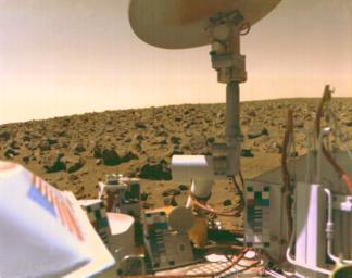 The boulder-strewn field of red rocks reaches to the horizon nearly two miles from NASA's Viking 2 on Mars' Utopian Plain.