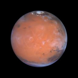 Astronomers using NASA's Hubble Space Telescope took this view of Mars taking advantage of the space-based observatory's close approach to Mars, centering on the region known as Tharsis, home of the largest volcanoes in the solar system.