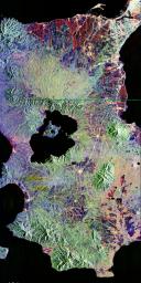 This is an image NASA's Spaceborne Imaging Radar-C/X-band Synthetic Aperture of Taal volcano, near Manila on the island of Luzon in the Philippines. The black area in the center is Taal Lake, which nearly fills the 30-kilometer-diameter (18-mile) caldera.