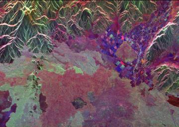 Ancient lava flows dating back 2,000 to 15,000 years are shown in light green and red on the left side of this space radar image from NASA's Spaceborne Imaging Radar-C/X-band Synthetic Aperture of the Craters of the Moon National Monument area in Idaho.