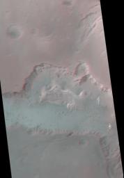 Ganges Chasma is part of the Valles Marineris trough system that stretches nearly 5,000 kilometers (3,000 miles) across the western equatorial region of Mars. This stereo anaglyph is from NASA's Mars Global Surveyor.
