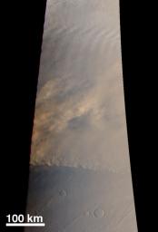 NASA's Mars Global Surveyor captured a dust storm advancing across the northern plains toward Tempe Terra on August 22, 1998.