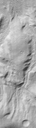 NASA's Mars Global Surveyor shows the wall of a 72 kilometer-wide (45 mile-wide) impact crater in Promethei Terra on Mars. Its inner walls appear to be deeply gullied.