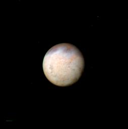 This image, taken by NASA's Voyager 2 early in the morning of Aug. 23, 1989, is a false color image of Triton, Neptune's largest satellite; mottling in the bright southern hemisphere is present.