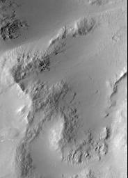 NASA's Mars Global Surveyor shows smooth, mantled surfaces, as well as bare, rocky surfaces on Mars.