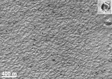 NASA's Mars Global Surveyor shows two craters, a very rare occurrence on Mars' south polar layered deposits.