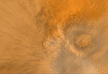 NASA's Mars Global Surveyor shows Arsia Mons, one of the largest volcanoes known on Mars. This shield volcano is part of an aligned trio known as the Tharsis Montes, the others are Pavonis Mons and Ascraeus Mons.