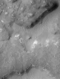 NASA's Mars Global Surveyor shows jumbled and broken terrain known as chaotic terrain. The region shown here is named 'Margaritifer Chaos.'