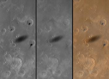 NASA's Mars Global Surveyor shows the shadow of the martian moon, Phobos, as it was cast upon western Xanthe Terra on August 26, 1999.
