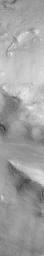 NASA's Mars Global Surveyor shows a group of four small hills surrounded by the larger mountains in the Cydonia region of Mars.