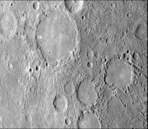 As NASA's Mariner 10 approached Mercury at nearly seven miles per second on March 29, 1974, its TV camera took this picture from an altitude of 35,000 kilometers (21,700 miles) The picture shows a heavily-cratered surface with many low hills.