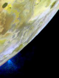 A plume of gas and particles is ejected some 100 kilometers (about 60 miles) above the surface of Jupiter's volcanic moon Io in this color image, recently taken by NASAs Galileo spacecraft.