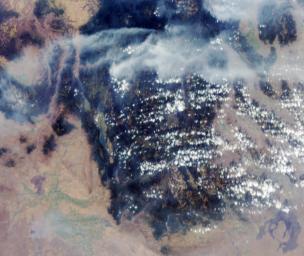 These images from NASA's Terra satellite are of smoke plumes from devastating wildfires in the northwestern U.S. This view of the Clearwater and Salmon River Mountains in Idaho was acquired on August 5, 2000 (Terra orbit 3370).
