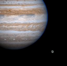 Jupiter casts a baleful eye toward the moon Ganymede in this enhanced-contrast image from NASA's Cassini spacecraft.