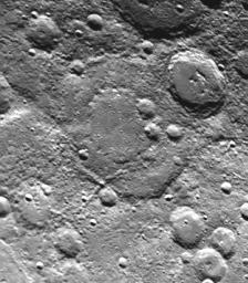 Taken about 40 minutes before NASA's Mariner 10 made its close approach to Mercury on Sept. 21,1974, this picture shows a large double-ringed basin (center of picture) located in the planet's south polar region