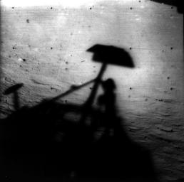 Image of Surveyor 1's shadow against the lunar surface in the late lunar afternoon, with the horizon at the upper right. Surveyor 1, the first of the Surveyor missions to make a successful soft landing, proved the spacecraft design and landing technique