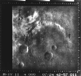 This image from NASA's Mariner 4 shows a crater in the Atlantis region. Mariner 4 revealed Mars to have a cratered, rust-colored surface.