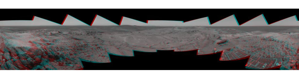 Before moving on to explore more of Mars, NASA's Mars Exploration Rover Spirit looked back at the long and winding trail of twin wheel tracks the rover created to get to the top of 'Husband Hill.' 3D glasses are necessary to view this image.