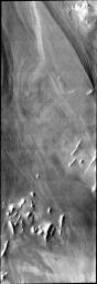This image illlustrates how distinct polar layers appear with no frost cover. This image was collected during the height of summer at the south pole of Mars by NASA's 2001 Mars Odyssey spacecraft.