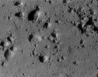 This image of asteroid 433 Eros, taken by NASA's NEAR Shoemaker shows a cluster of rocks at the upper right measuring 1.4 meters (5 feet) across.
