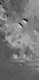 NASA's Mars Global Surveyor shows light-toned rock outcrops in northeastern Sinus Meridiani on Mars. The entire northern Sinus Meridiani region has vast exposures of light-toned, layered rock.