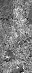 NASA's Mars Global Surveyor shows eroded sedimentary rock outcrops in northern Sinus Meridiani on Mars.