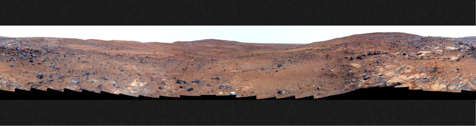 In late November 2005 while descending 'Husband Hill,' NASA's Mars Exploration Rover Spirit took the most detailed panorama so far of the 'Inner Basin,' the rover's next target destination. An abundance of rocks upon red soil is shown in false-color.