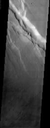 This NASA Mars Odyssey image covers a tract of plateau territory called Ophir Planum. The most obvious features in this scene are the fractures (ranging from 1 to 5 km wide) running from the upper left to lower right.