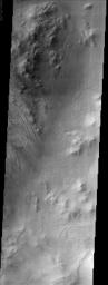 This image from NASA's Mars Odyssey spacecraft shows part of Galle Crater. It was taken far enough south and late enough into the southern hemisphere fall to observe water ice clouds partially obscuring the surface.
