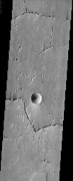 Off the western flank of Elysium are the Hephaestus Fossae, seen in this image from NASA's Mars Odyssey, with linear arrangements of small, round pits. These features are commonly called 'pit chains' and most likely represent the collapse of lava tubes.