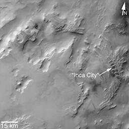 This image from NASA's Mars Global Surveyor taken in 2002, shows that the 'Inca City' ridges, located at 82S, 67W, are part of a larger circular structure that is about 86 km (53 mi) across.