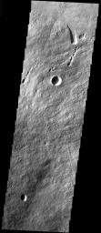 This image from NASA's Mars Odyssey spacecraft shows the part of the NE flank of Arsia Mons where it meets the plains. The flank of the volcano is comprised of long flows. Collapse features are present at the flank margin.