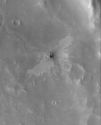 NASA's Mars Global Surveyor shows a small impact crater with a 'butterfly' ejecta pattern. The butterfly pattern results from an oblique impact.