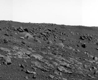 NASA's Spirit rover's panoramic camera took this mosaic on July 20, 2005, as it approached a suite of layered rocks named 'Voltaire.' Seven to eight discrete layers are evident.