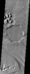 With its rim eroded off by catastrophic floods in Tiu Vallis and its strangely angular shape, this 12 km (about 7.5 mile) diameter crater imaged by NASA's Mars Odyssey spacecraft looks vaguely like a stop sign.