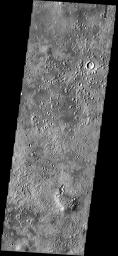 The small mounds with summit depressions in the northern part of this NASA Mars Odyssey image have an unknown origin. Some scientists think they may be cinder cones, while others think they may be pseudocraters, formed by the interaction of lava and ice.